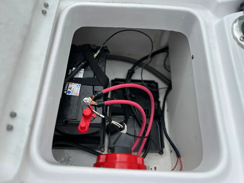 Slide: The Image of 2024 Clearwater 2100 Baystar boat battery compartment with wiring. - 14