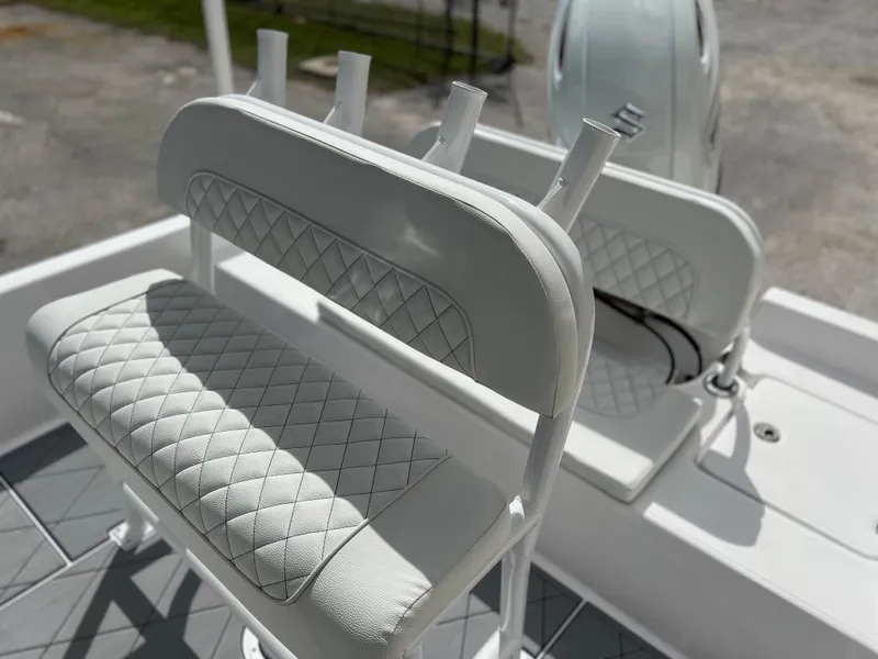 Slide: The Image of 2024 Clearwater 2100 Baystar boat with cushioned seating and rod holders. - 17