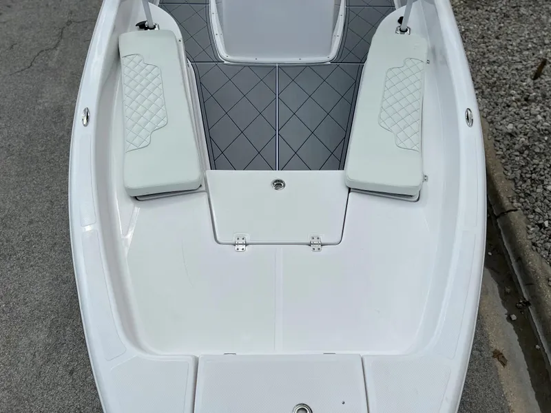 Slide: The Image of 2024 Clearwater 2100 Baystar boat interior with cushioned seating and non-slip flooring. - 21