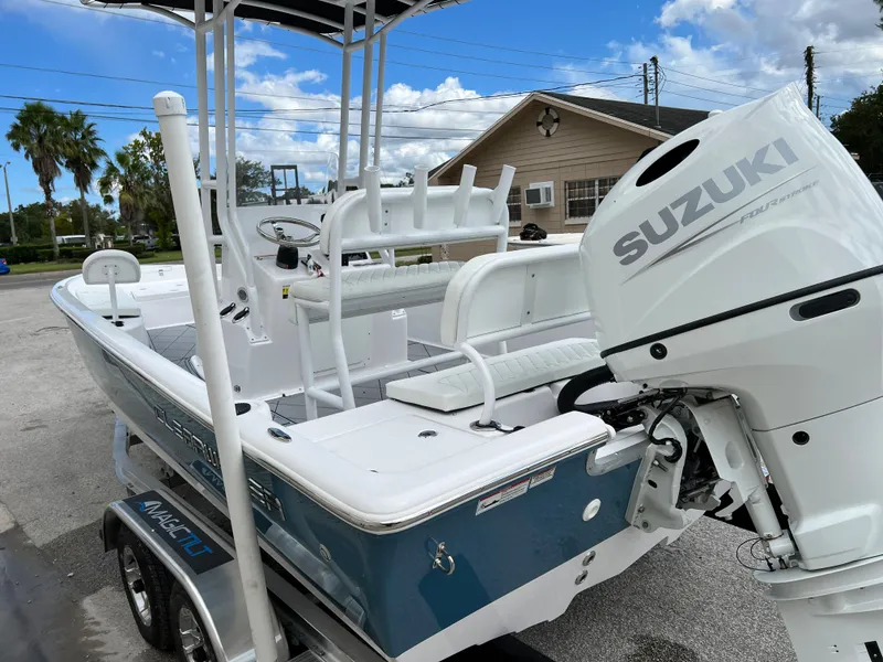 Slide: The Image of 2024 Clearwater 2100 Baystar boat with Suzuki outboard motor on trailer. - 6