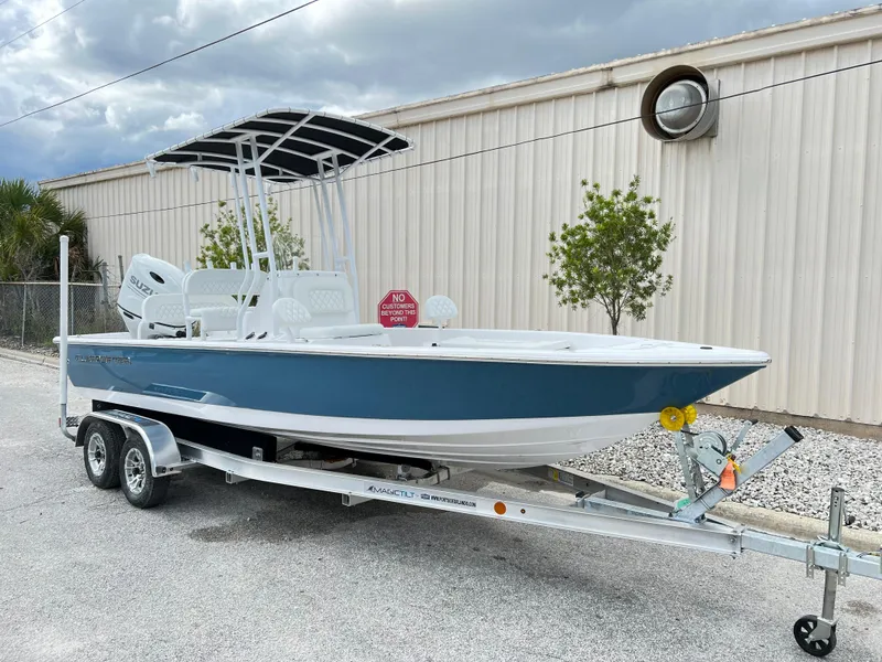 Slide: The Image of 2024 Clearwater 2100 Baystar boat on a trailer, parked outdoors. - 9