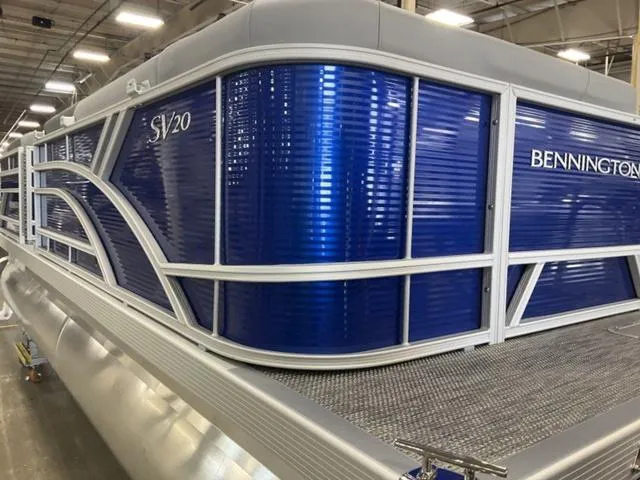 Slide: The Image of 2024 Bennington 20 SVL 3 SPS pontoon boat in a showroom. - 10