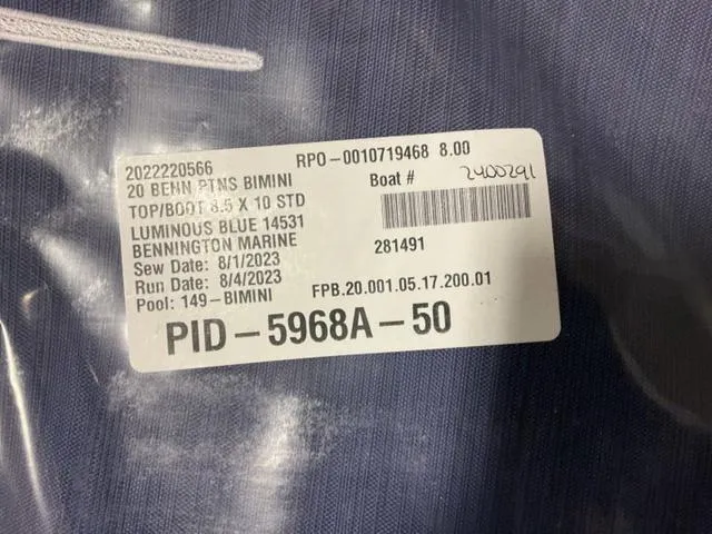 Slide: The Image of Label on a 2024 Bennington 20 SVL 3 SPS boat bimini top in luminous blue. - 23