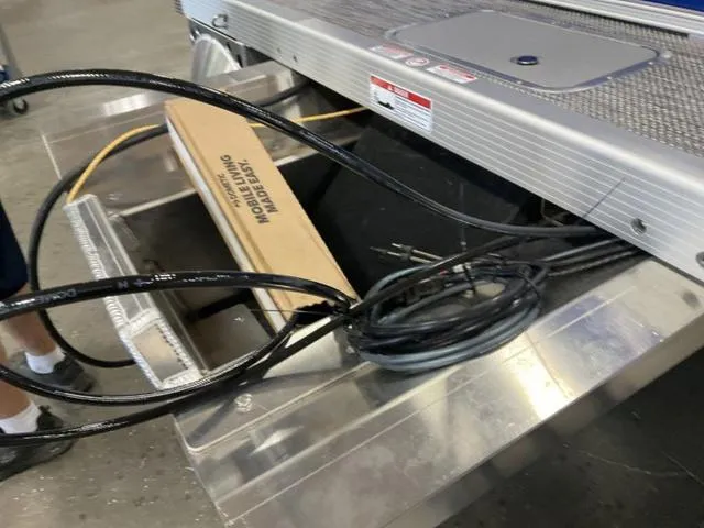 Slide: The Image of 2024 Bennington 20 SVL 3 SPS boat assembly with cables and components. - 8