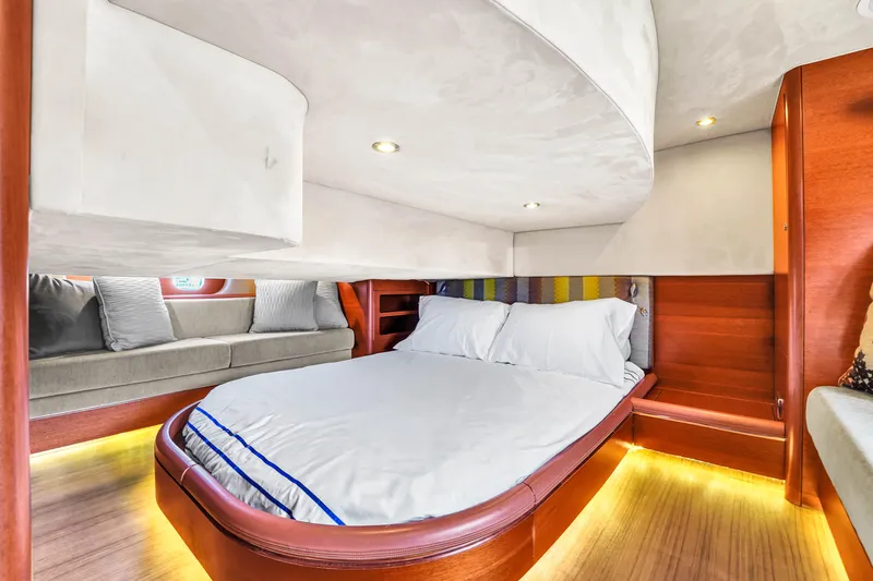 Slide: The Image of Luxurious cabin interior of 2012 Zeelander 44 yacht with cozy bed and ambient lighting. - 12