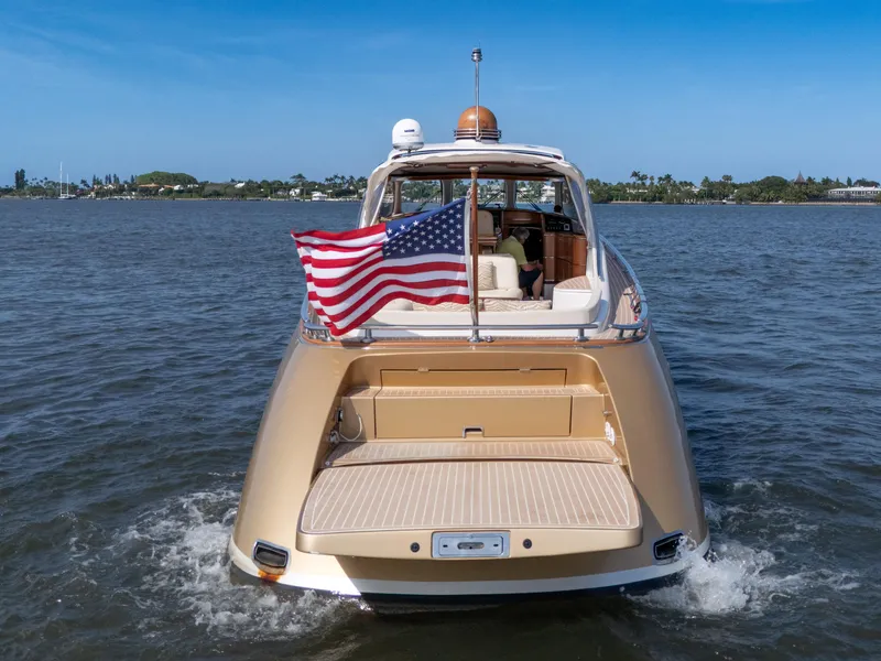 Slide: The Image of Luxury 2012 Zeelander 44 yacht with American flag on open water. - 14