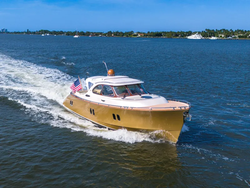 Slide: The Image of 2012 Zeelander 44 yacht cruising on a sunny day with an American flag. - 2
