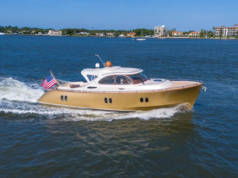Slide: The Image of Zeelander 44 yacht cruising on water, 2012 model, with American flag. - 3