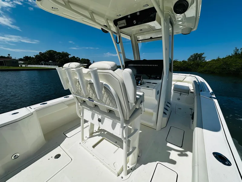 Slide: The Image of 2024 World Cat 260 CC-X boat interior with white seating and console. - 13