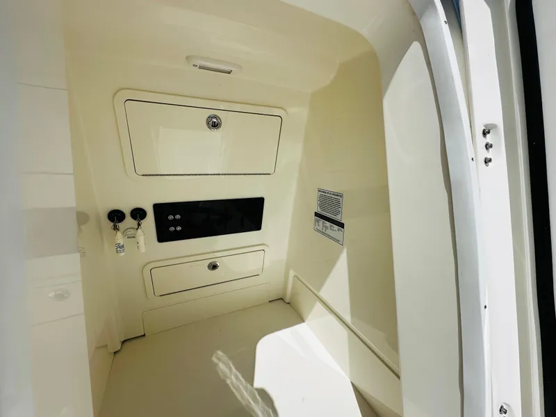 Slide: The Image of 2024 World Cat 260 CC-X interior storage compartment with control panel. - 20