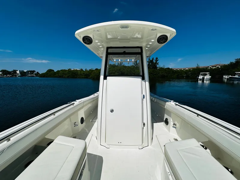 Slide: The Image of 2024 World Cat 260 CC-X boat on calm water, front view. - 26
