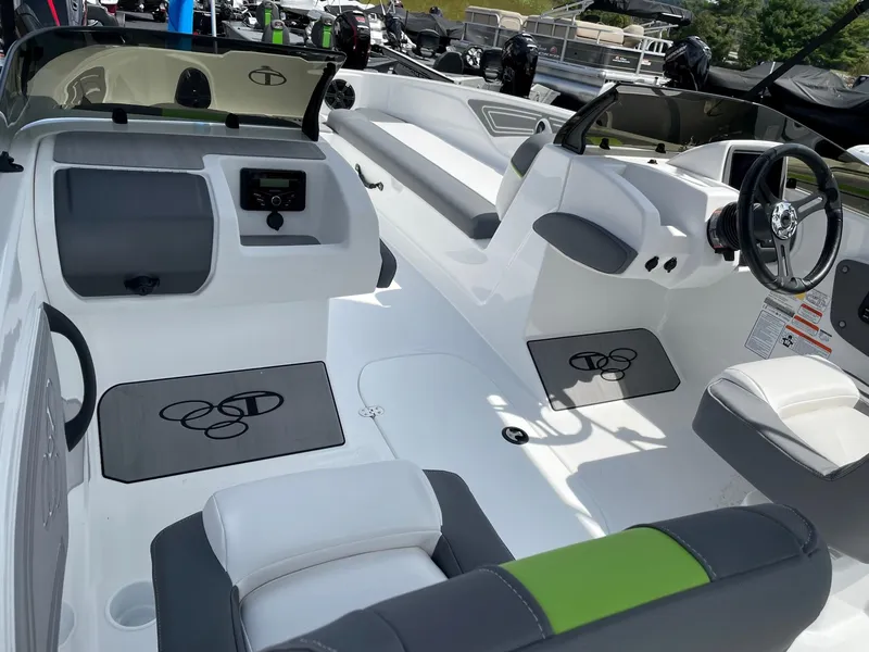 Slide: The Image of 2024 Tahoe T21 boat interior with modern seating and sleek dashboard design. - 7