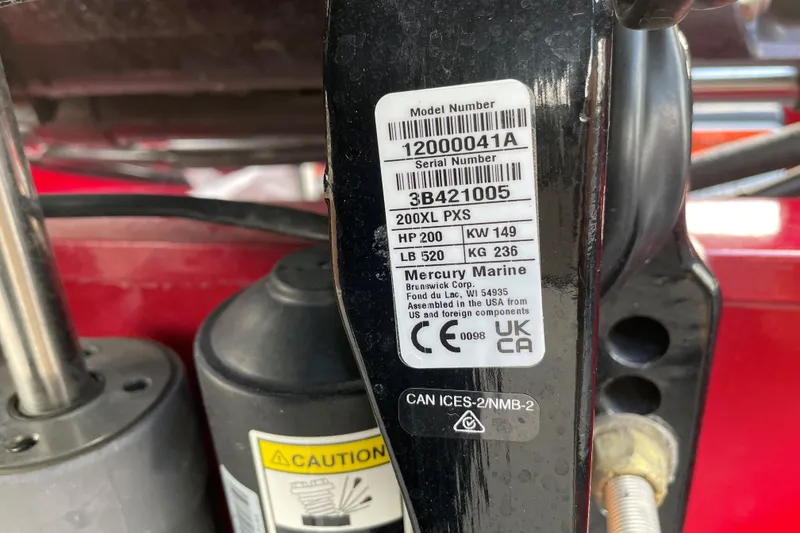 Slide: The Image of Label on 2024 Tracker Targa V-18 WT boat engine, showing model and serial numbers. - 66