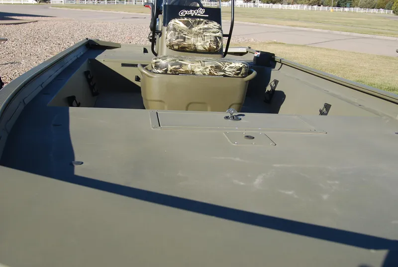 Slide: The Image of 2024 Tracker Grizzly 1860 CC boat interior with camouflage seating. - 3