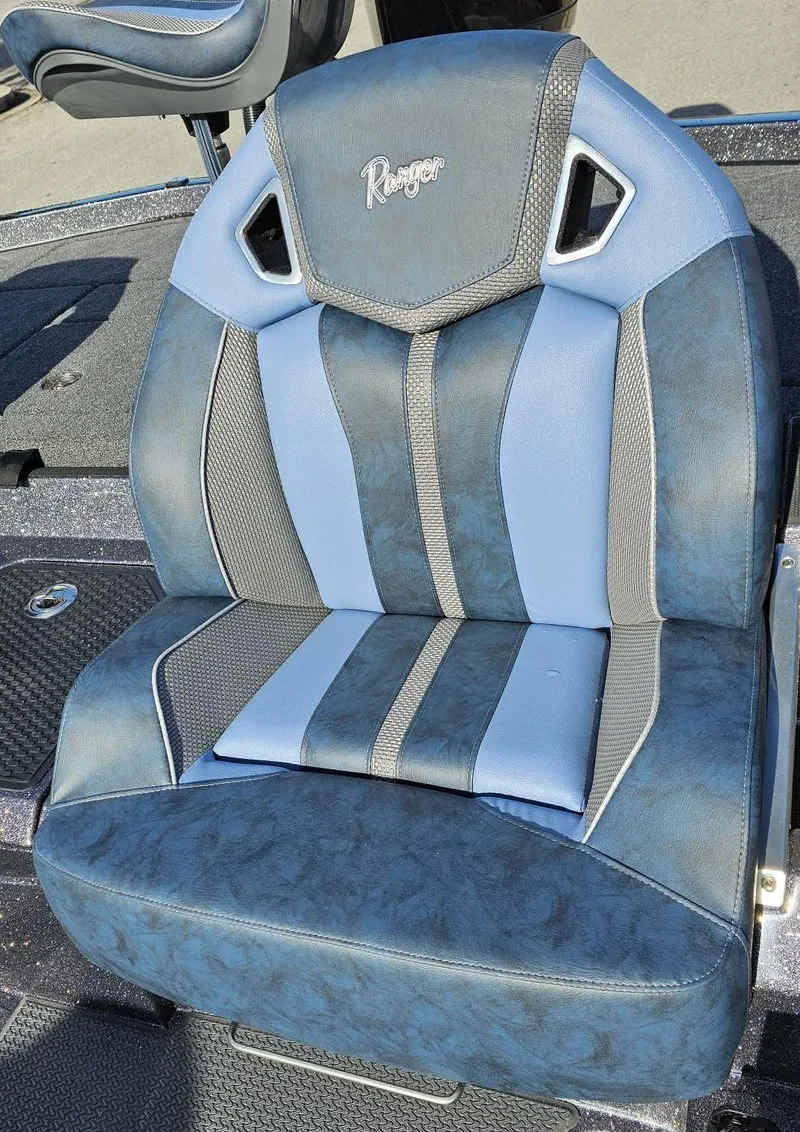 Slide: The Image of 2024 Ranger Z521R boat seat with blue and gray upholstery. - 14