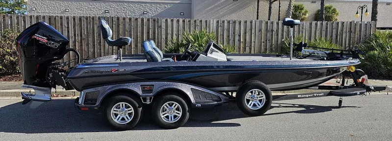 Slide: The Image of 2024 Ranger Z521R bass boat on a trailer, side view. - 2