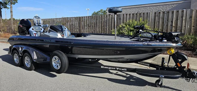Slide: The Image of 2024 Ranger Z521R bass boat on a trailer, parked outdoors. - 3