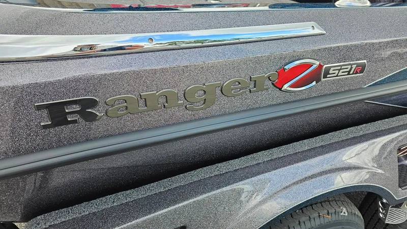 Slide: The Image of 2024 Ranger Z521R boat model close-up with logo and metallic finish. - 9
