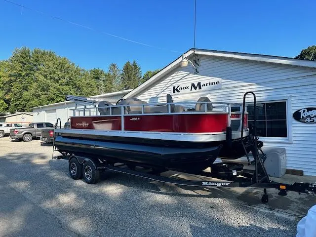 Slide: The Image of 2024 Ranger RP200F pontoon boat on trailer at Knox Marine dealership. - 2
