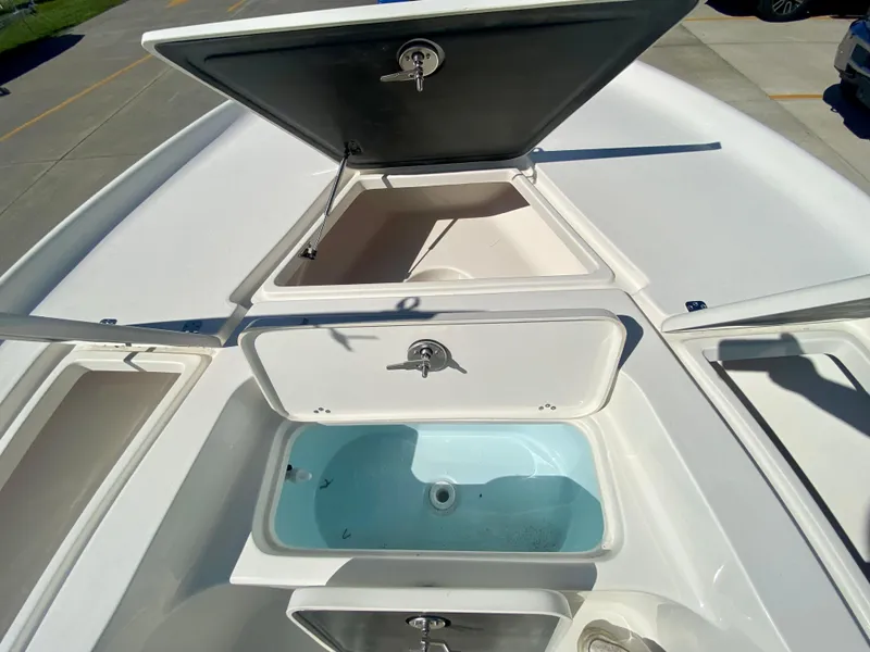 Slide: The Image of 2024 Key West 230 Bay Reef boat storage compartments and livewell. - 25