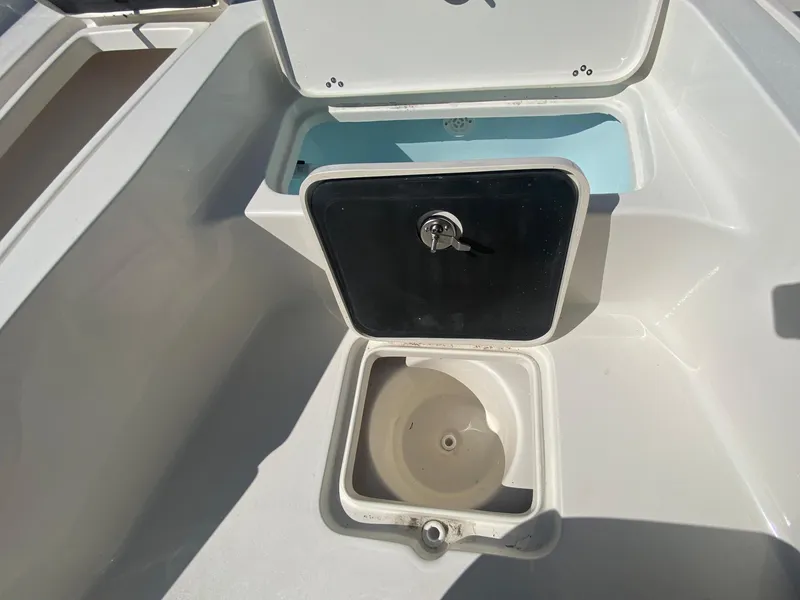 Slide: The Image of 2024 Key West 230 Bay Reef boat storage compartments and livewell. - 26