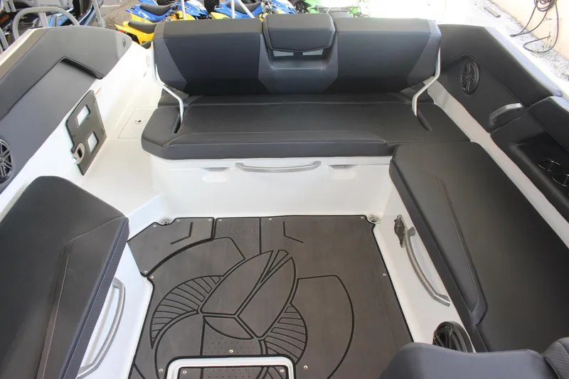 Slide: The Image of 2023 Scarab 285 ID boat interior with black seating and modern design. - 3