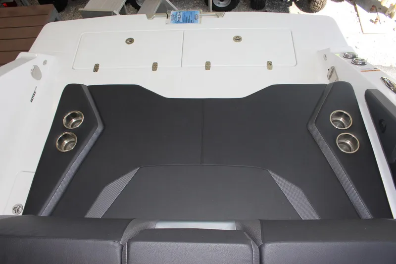 Slide: The Image of 2023 Scarab 285 ID boat with black and white seating area and cup holders. - 4