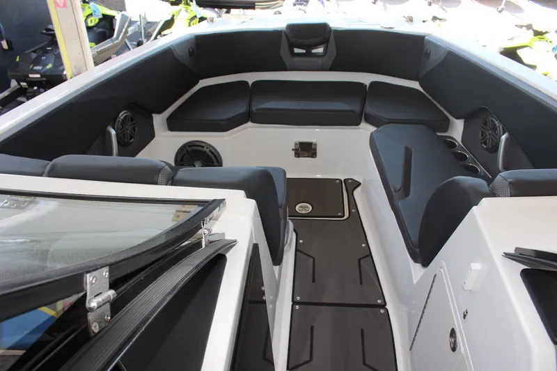 Slide: The Image of 2023 Scarab 285 ID boat interior with black seating and modern design. - 6