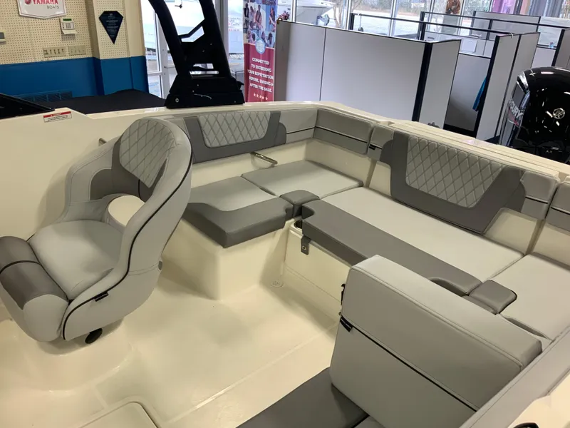 Slide: The Image of 2024 Bayliner VR4 Bowrider OB interior with gray seating and modern design. - 2