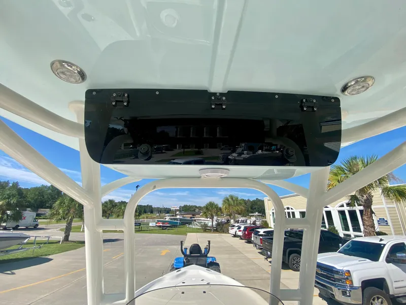 Slide: The Image of 2024 Key West 230 Bay Reef boat console and T-top view. - 15
