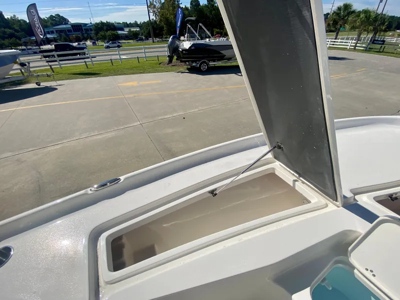 Slide: The Image of 2024 Key West 230 Bay Reef boat with open storage compartment. - 27