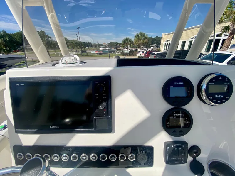 Slide: The Image of 2024 Key West 230 Bay Reef boat dashboard with Garmin navigation system. - 14