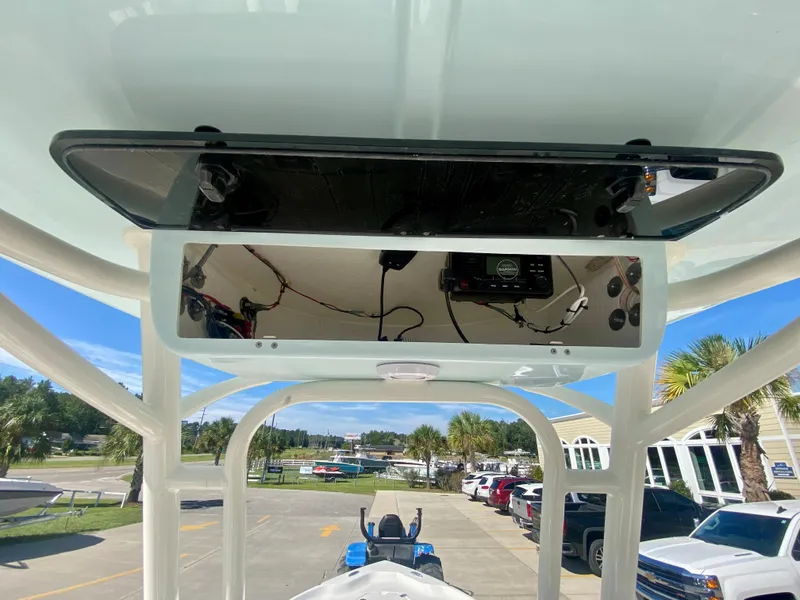 Slide: The Image of 2024 Key West 230 Bay Reef boat console with electronics and storage. - 16