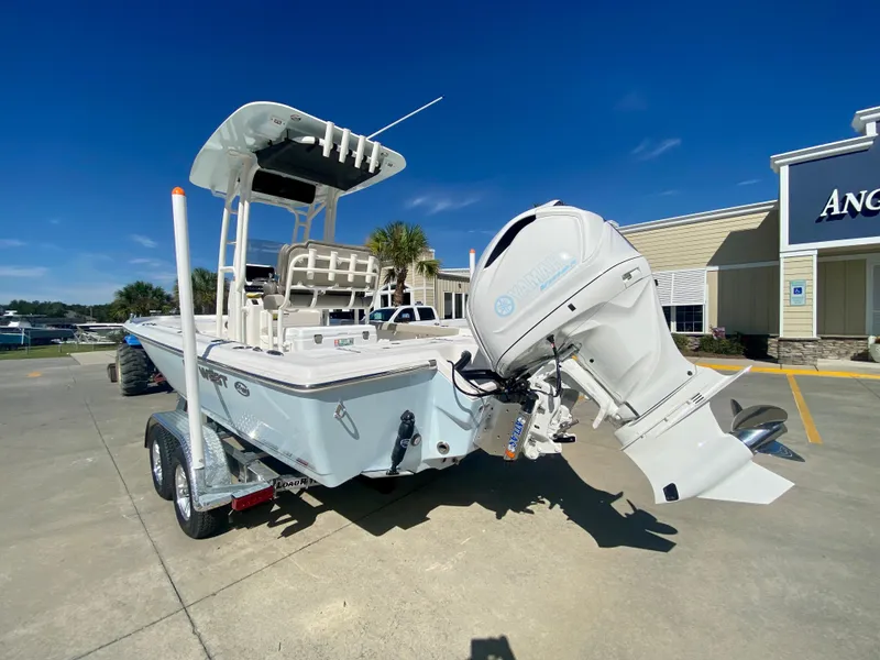 Slide: The Image of 2024 Key West 230 Bay Reef boat on a trailer, rear view. - 4