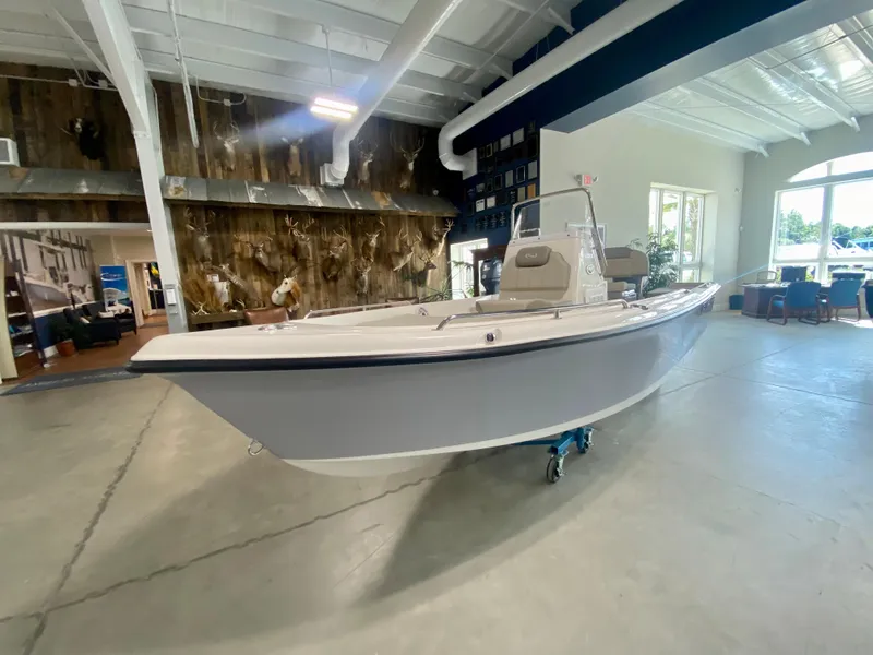 Slide: The Image of 2024 Key West 1720 CC boat displayed in a showroom. - 4