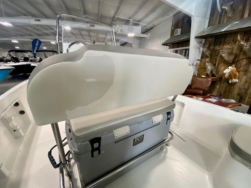 Slide: The Image of 2024 Key West 1720 CC boat interior with cooler and seating. - 8