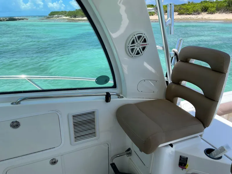 Slide: The Image of Interior view of 2010 Boston Whaler 345 Conquest boat with ocean backdrop. - 18