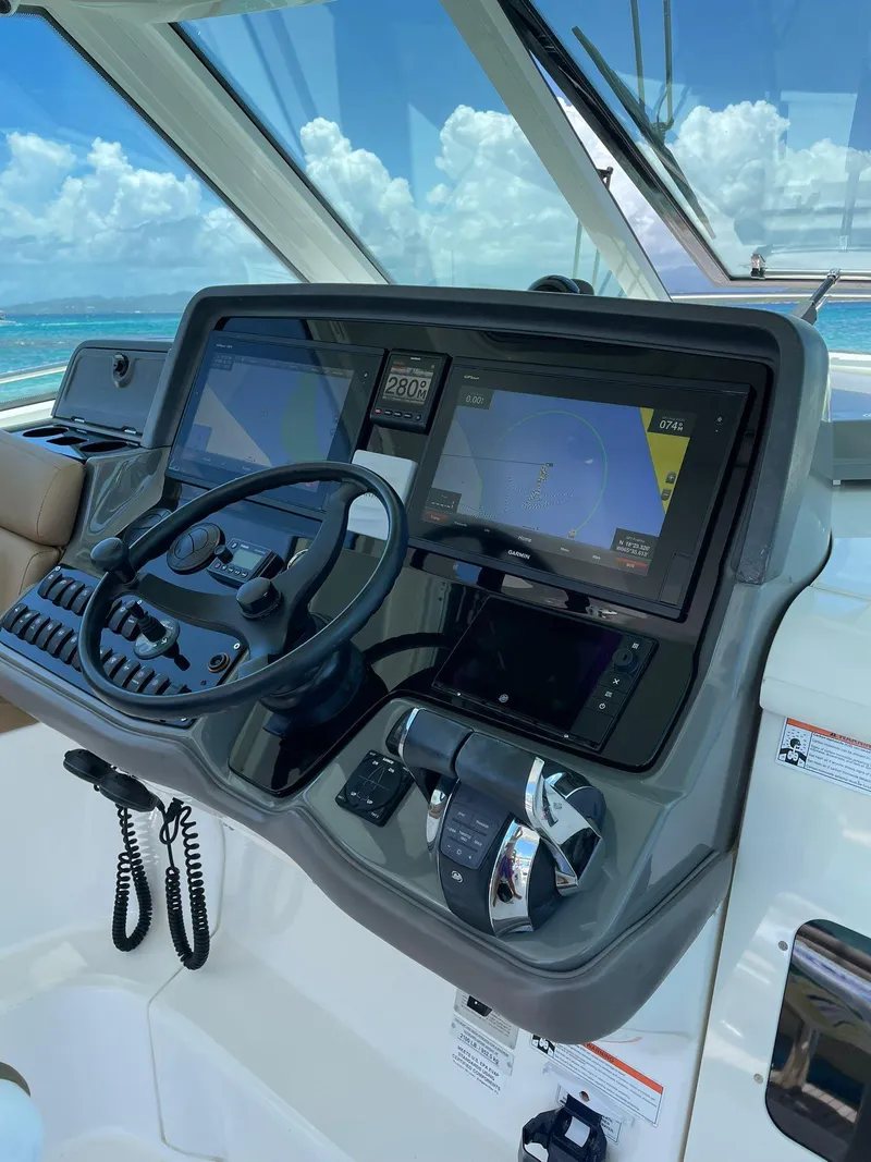 Slide: The Image of Helm of 2010 Boston Whaler 345 Conquest with advanced navigation systems. - 20