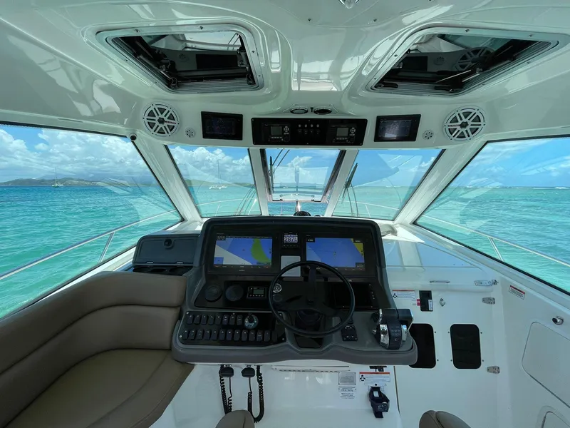 Slide: The Image of Helm of 2010 Boston Whaler 345 Conquest with ocean view and navigation equipment. - 21
