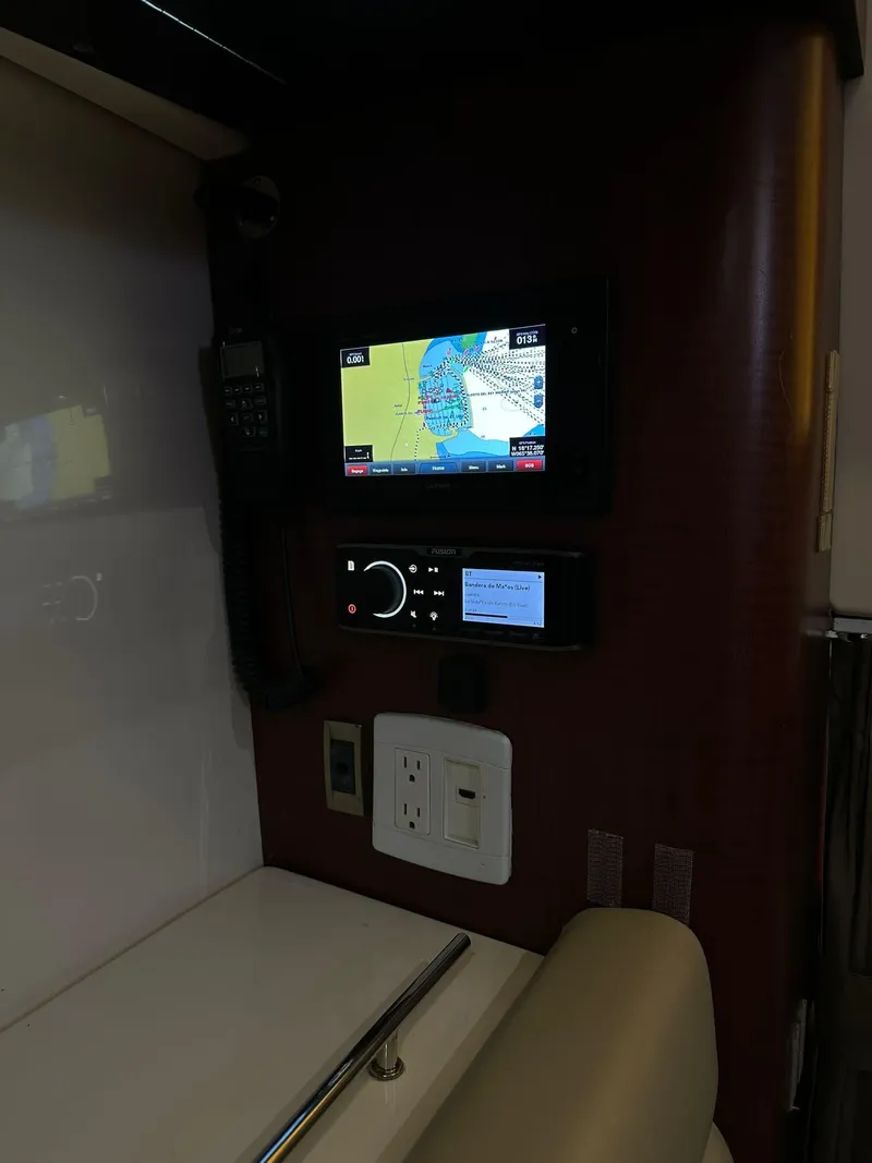 Slide: The Image of 2010 Boston Whaler 345 Conquest interior with navigation system and control panel. - 6