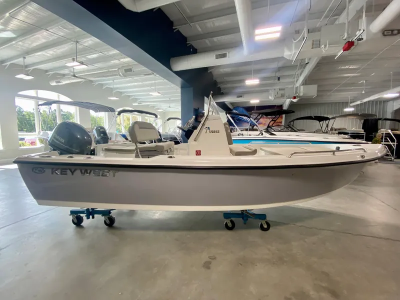 Slide: The Image of 2024 Key West 1720 CC boat displayed in a showroom. - 0
