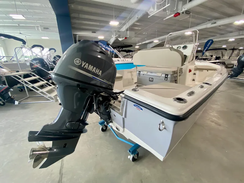 Slide: The Image of 2024 Key West 1720 CC boat with Yamaha outboard motor in showroom. - 1