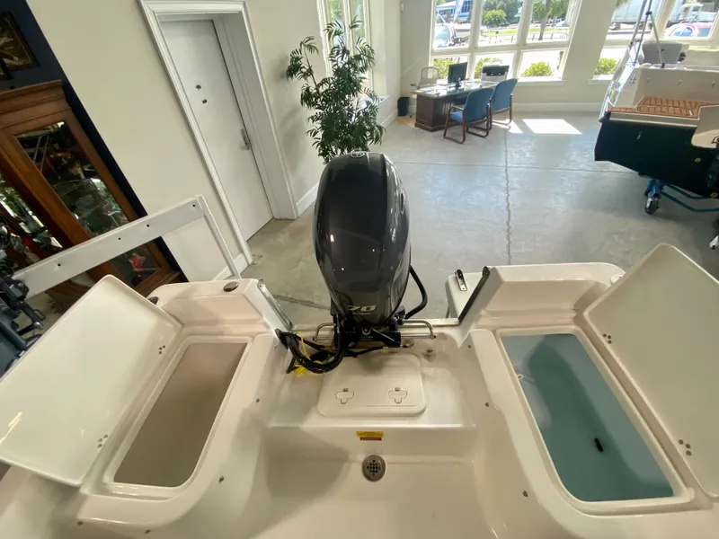 Slide: The Image of 2024 Key West 1720 CC boat interior with motor and storage compartments. - 7