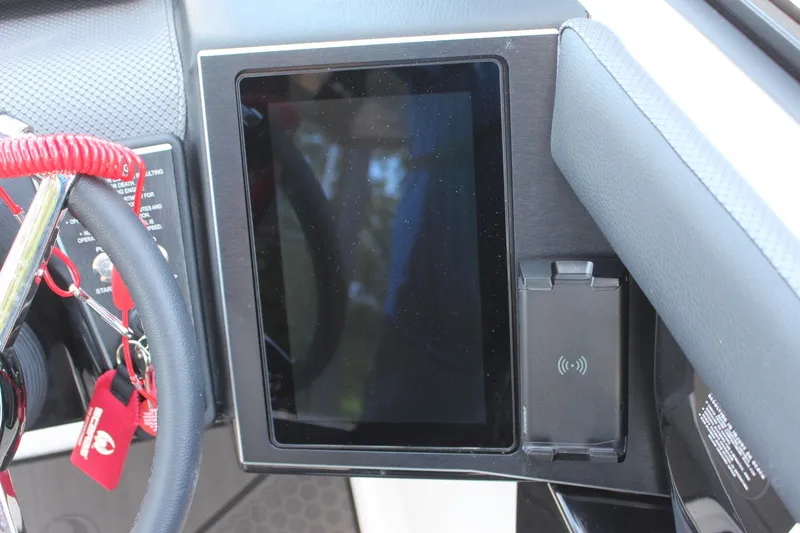 Slide: The Image of 2023 Scarab 285 ID dashboard with touchscreen and wireless charging pad. - 11