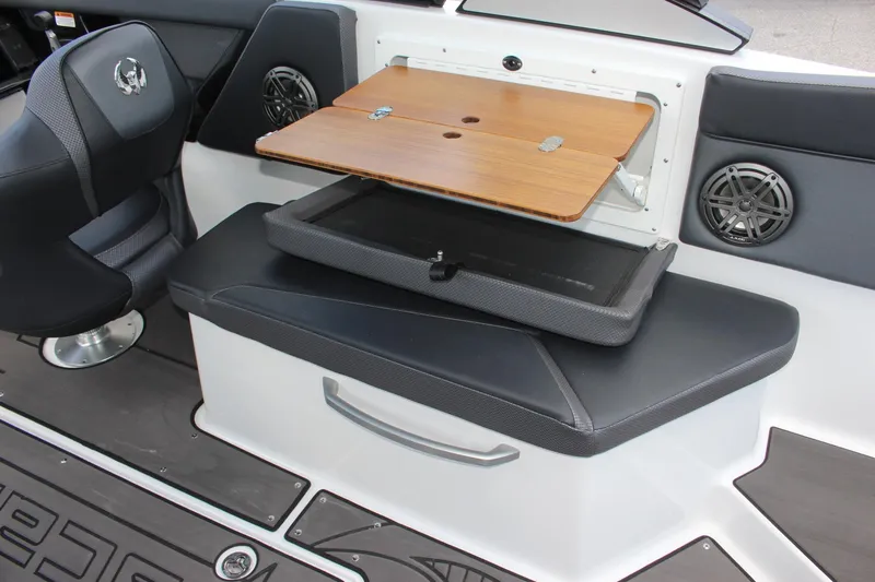 Slide: The Image of 2023 Scarab 285 ID boat interior with foldable table and seating. - 18