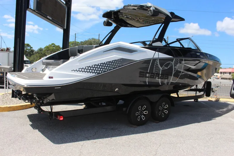 Slide: The Image of 2023 Scarab 285 ID boat on a trailer, side view. - 3