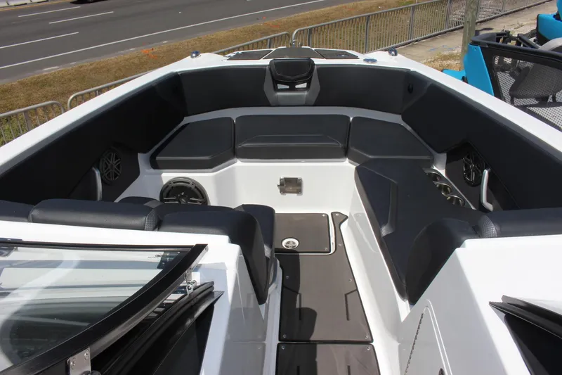 Slide: The Image of 2023 Scarab 285 ID boat interior with black seating and modern design. - 5
