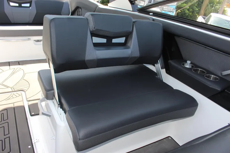 Slide: The Image of 2023 Scarab 285 ID boat interior with black and gray seating. - 7