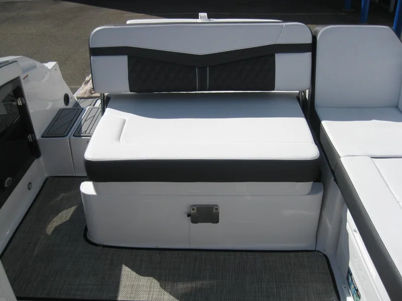 Slide: The Image of 2024 Monterey 258SS Super Sport boat seating in white and black. - 13