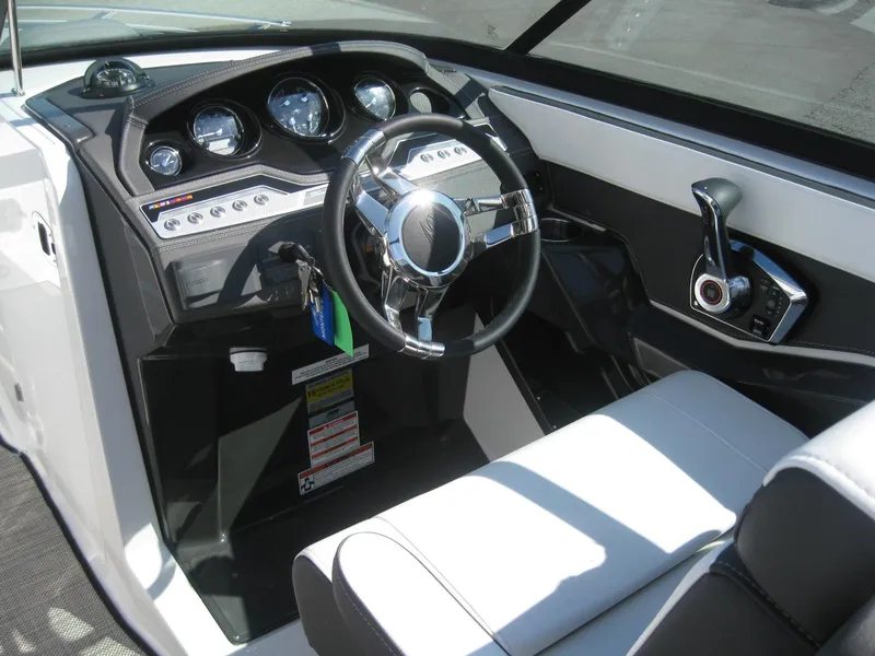 Slide: The Image of Interior of 2024 Monterey 258SS Super Sport boat with steering console. - 18